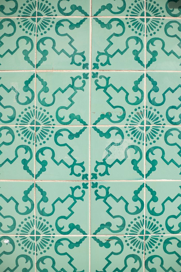 Mastering the First Impression: Your intriguing post title goes here Vibrant teal Portuguese azulejos tiles with intricate patterns in Lisbon, Portugal.